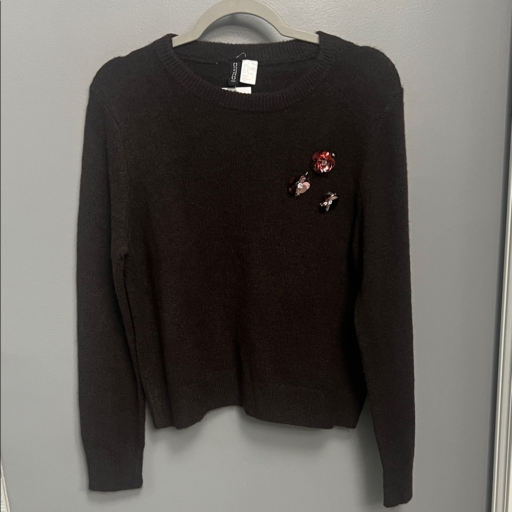 Elegant Black Sweater with Floral Accents